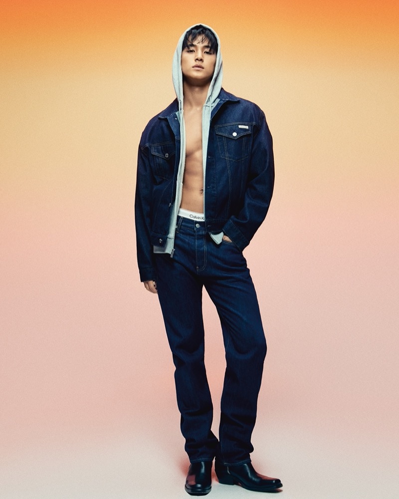 Doubling down on denim with a hoodie for an urban cool, MINGYU fronts Calvin Klein’s latest advertisement.