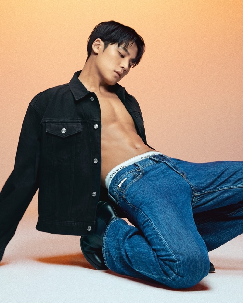 SEVENTEEN’s MINGYU makes a relaxed statement in a black trucker jacket and jeans for Calvin Klein.