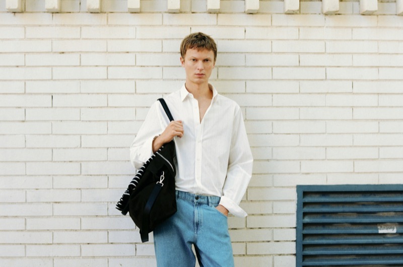 Jonas Glöer models a Massimo Dutti striped shirt with jeans.