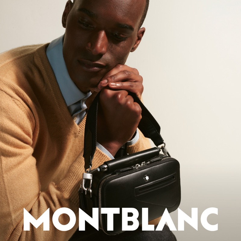 Corey Baptiste poses with a Montblanc soft double mini bag.