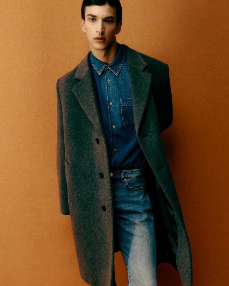 A Prada coat adds a formal touch to double denim.