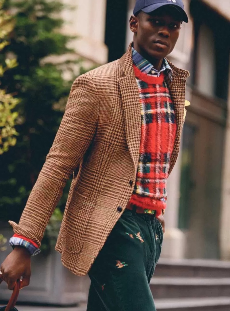 Cheikh Dia sports a Glen Plaid jacket over a red plaid sweater from Polo Ralph Lauren. 