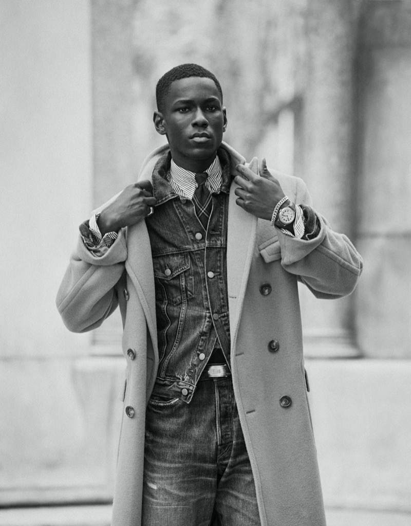 Cheikh Dia wears a denim jacket and jeans with an elegant double-breasted coat for Polo Ralph Lauren’s fall 2024 ad.