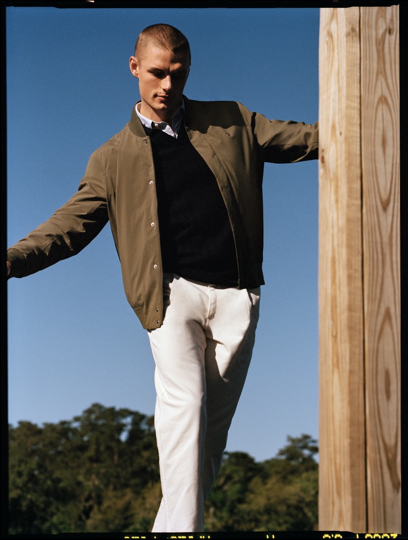 Finley Prentice models a bomber jacket and jeans from Tommy Hilfiger’s pre-fall 2024 collection.