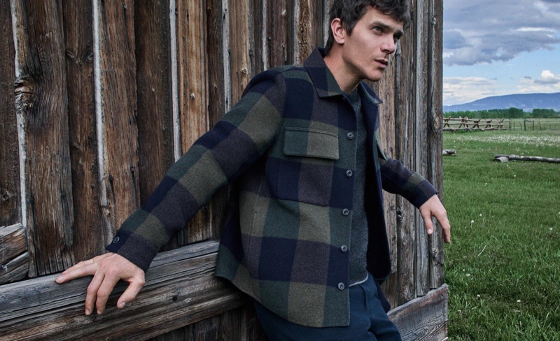 French model Vincent LaCrocq sports Vince’s check wool overshirt for the brand’s fall 2024 ad. 