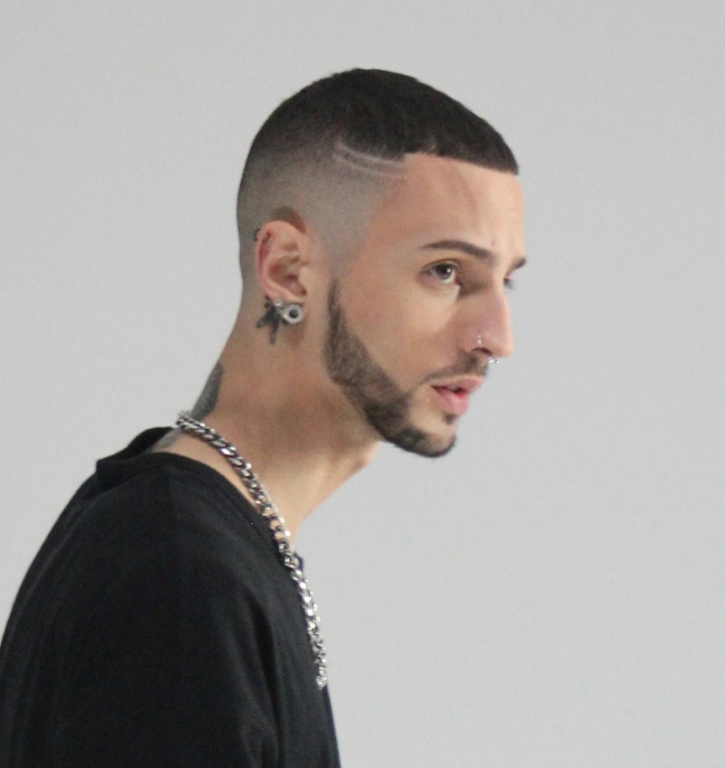 A buzz cut high skin fade delivers a sharp, clean finish. 