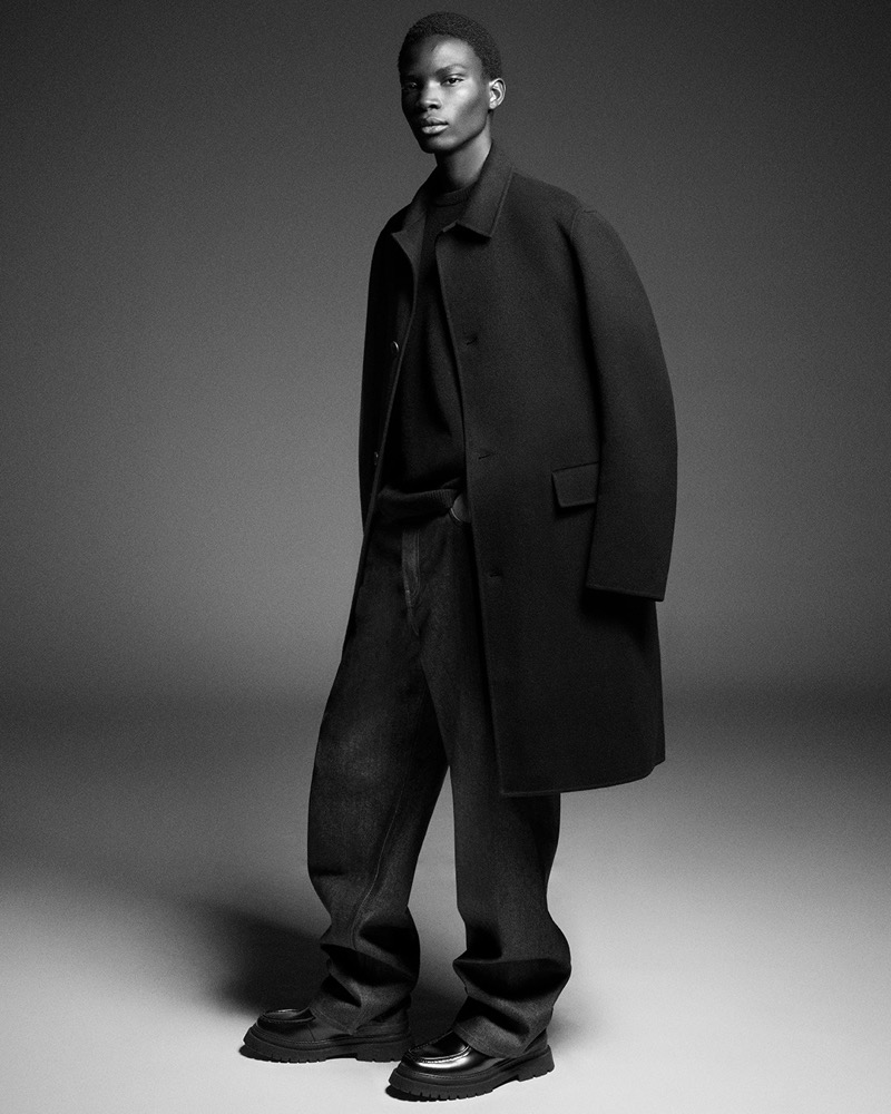 Dara Gueye sports a relaxed double-faced wool coat by COS.