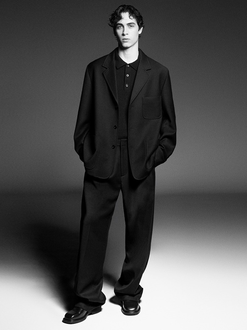 Aidan Bissett is pictured in chic, oversized tailoring for the COS fall-winter 2024 advertisement. 