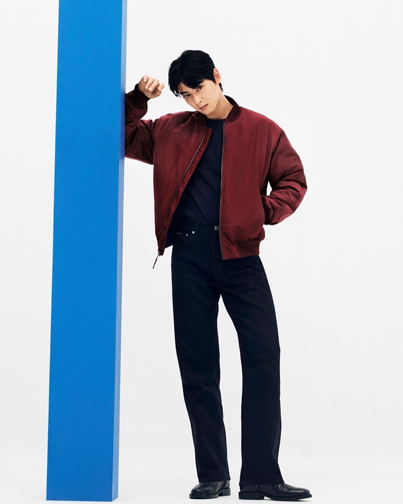 Singer Cha Eun-woo makes a casual statement in a red bomber jacket for Calvin Klein’s fall 2024 advertisement.