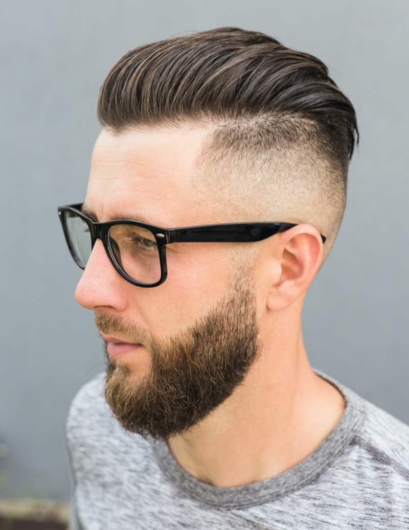 The comb over with a skin fade offers a refined style that works in any setting.