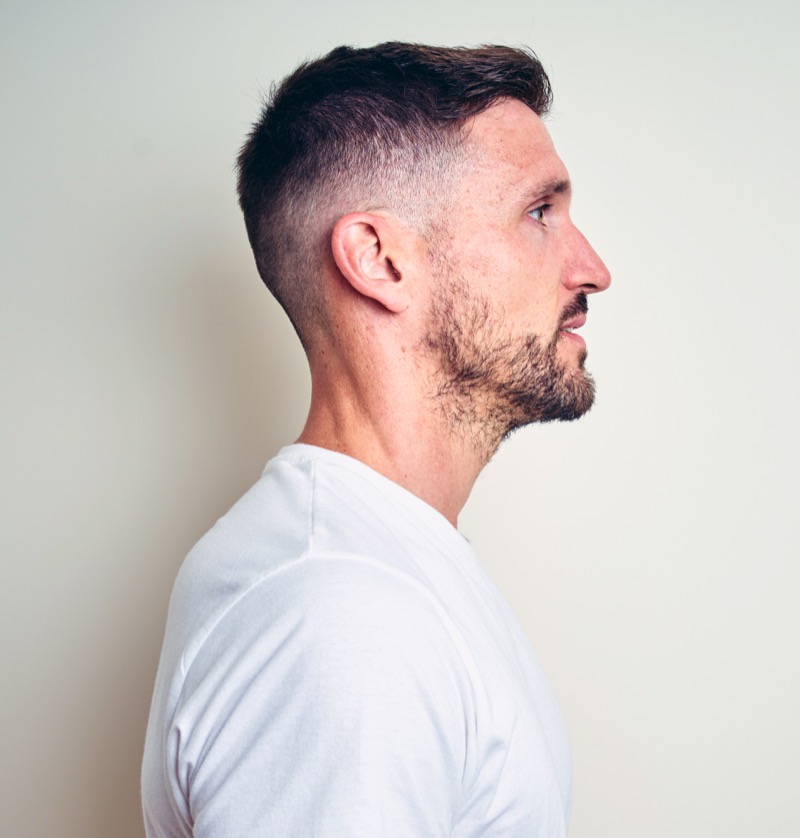 The crew cut with a mid skin fade offers a clean, refined look that’s timelessly sharp.