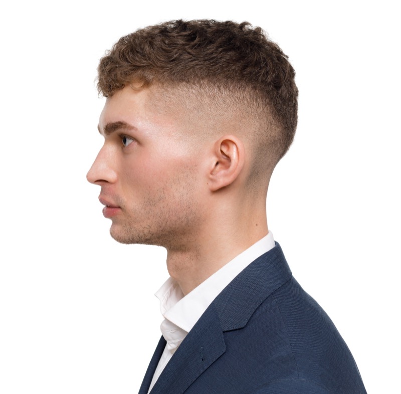 A skin fade brings out the best in curly hair, enhancing its natural texture.