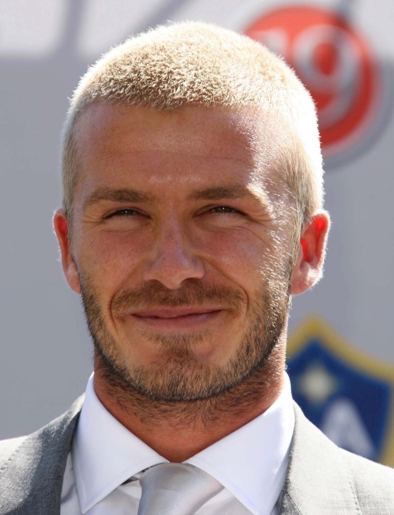 David Beckham’s dirty blonde buzz cut perfectly balances laid-back cool and polished refinement.