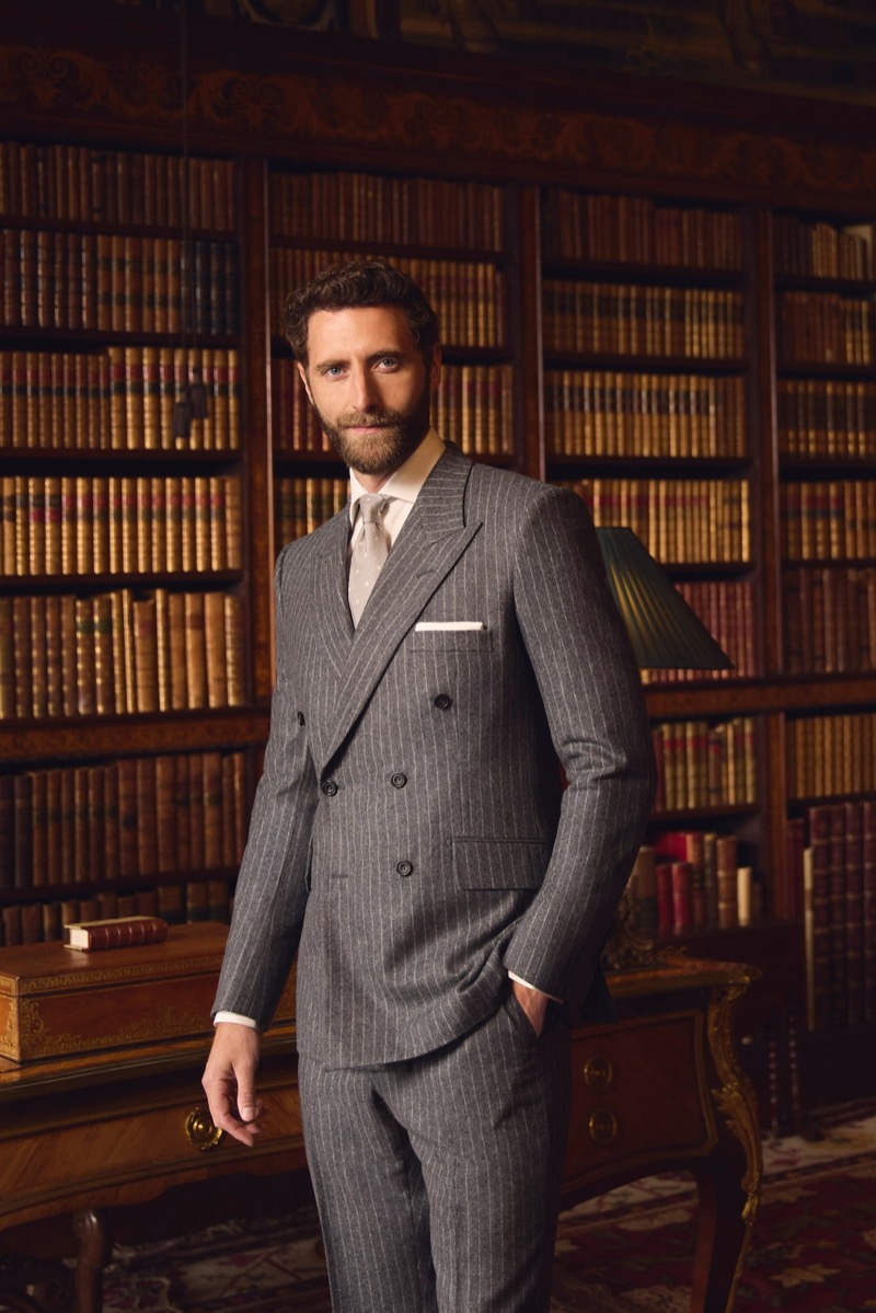 Max Hearne wears a grey pinstripe double-breasted suit for the Huntsman fall-winter 2024 campaign.