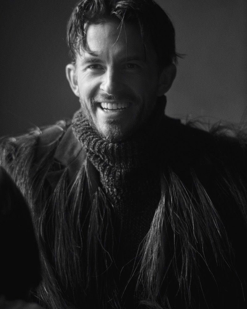 Gracing the pages of VMAN, Jonathan Bailey grins in a bold Givenchy look. 