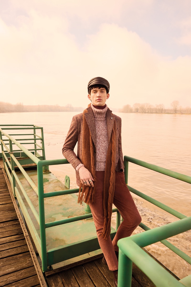 Model Eugen Ivanov wears rust-toned fashions from L.B.M.’s fall-winter 2024 collection.