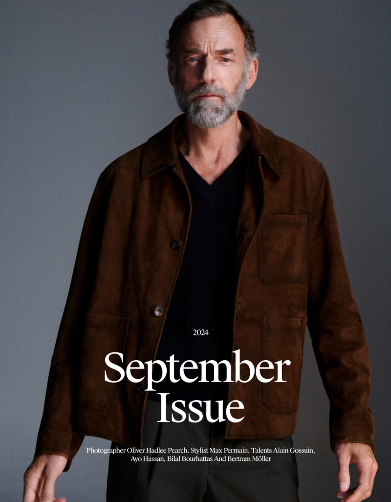 Alain Gossuin takes the spotlight in a Massimo Dutti brown suede jacket. 