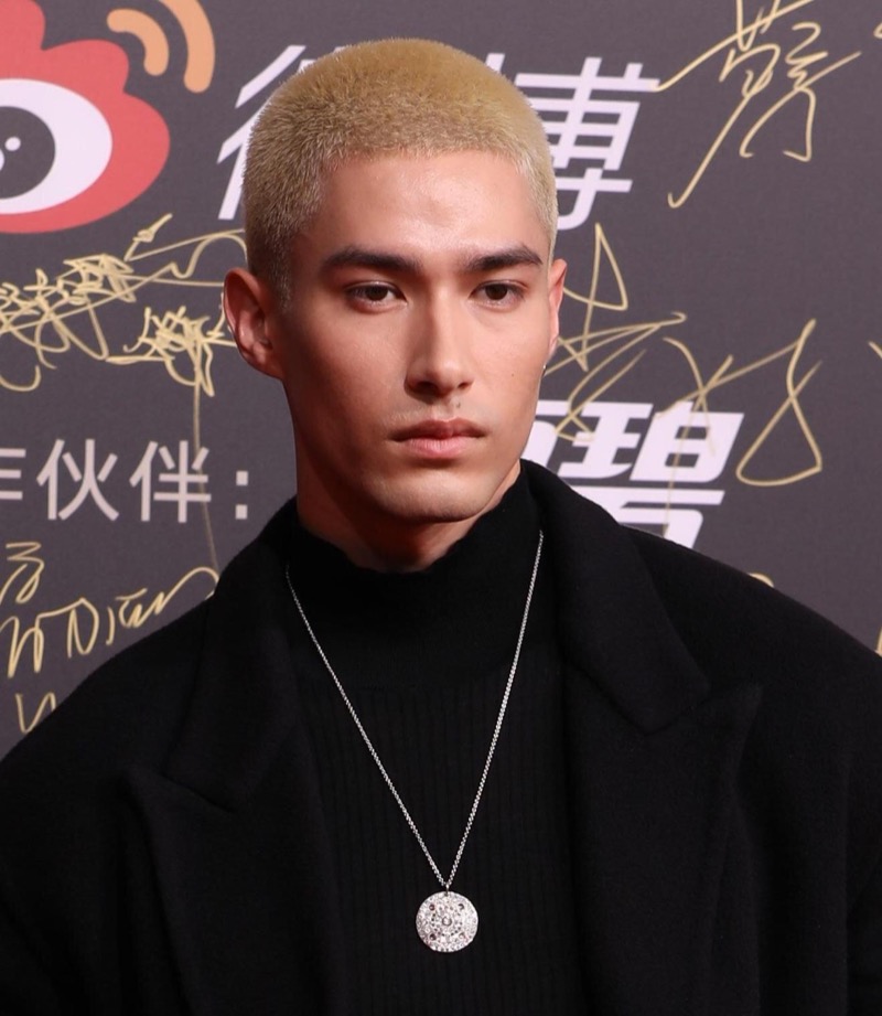 The blonde buzz cut stands out with its striking and transformative hue.