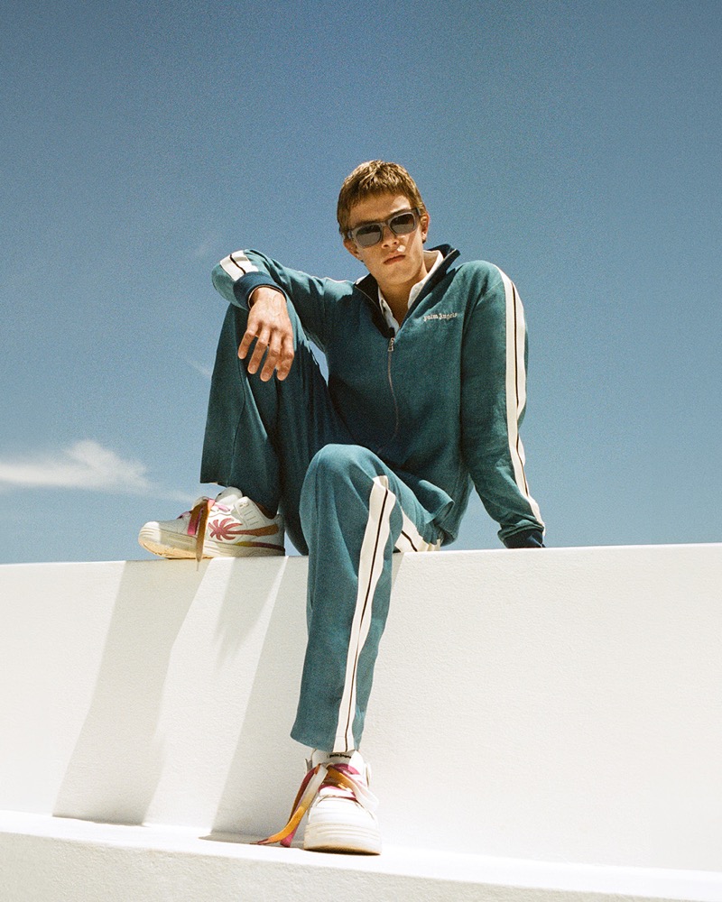 Model Samuel Luis Mueller sports a Palm Angels tracksuit for the brand’s fall-winter 2024 campaign.