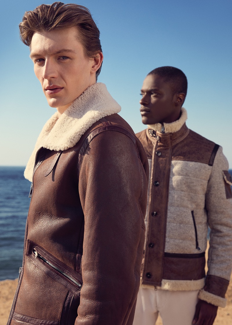 Models Finnlay Davis and Terry Frimpong wear shearling outerwear from Paul Stuart’s fall 2024 collection.