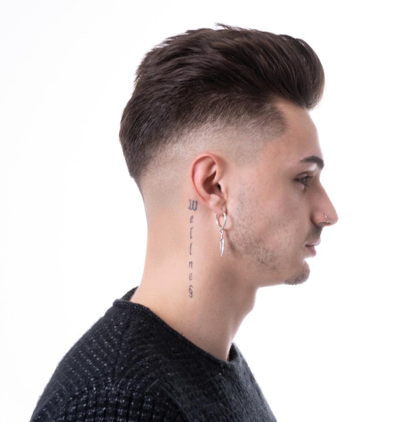 The pompadour with a high skin fade blends vintage flair with a contemporary edge. 