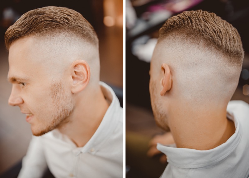 The slick back with a skin fade delivers a high-contrast style. 