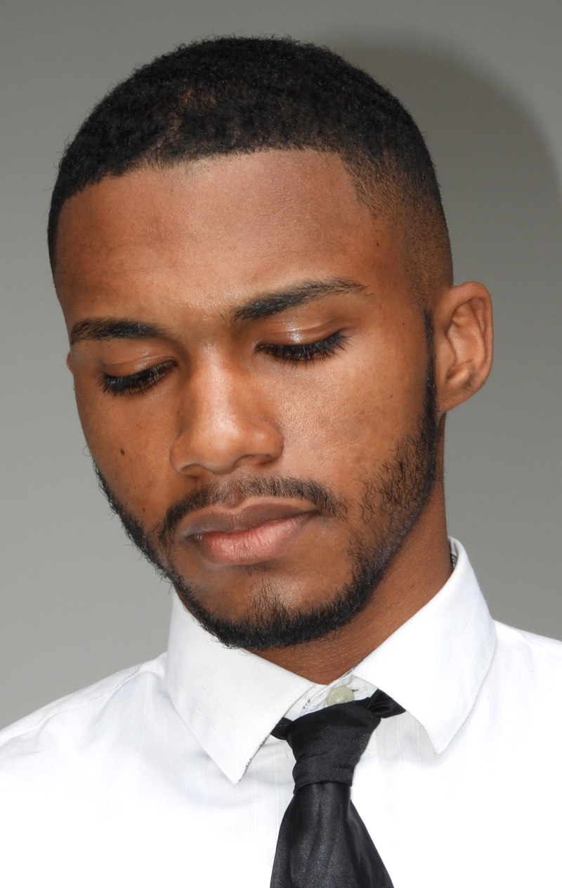 The tapered buzz cut stands out with its gradual fade, offering a softer, polished edge.