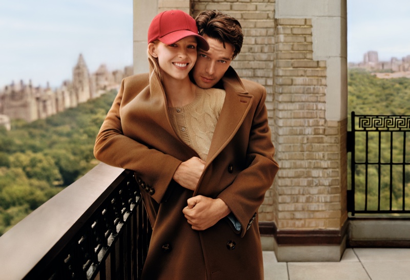 Embracing, Patrick Schwarzenegger and Abby Champion star in the Tommy Hilfiger fall 2024 advertisement.