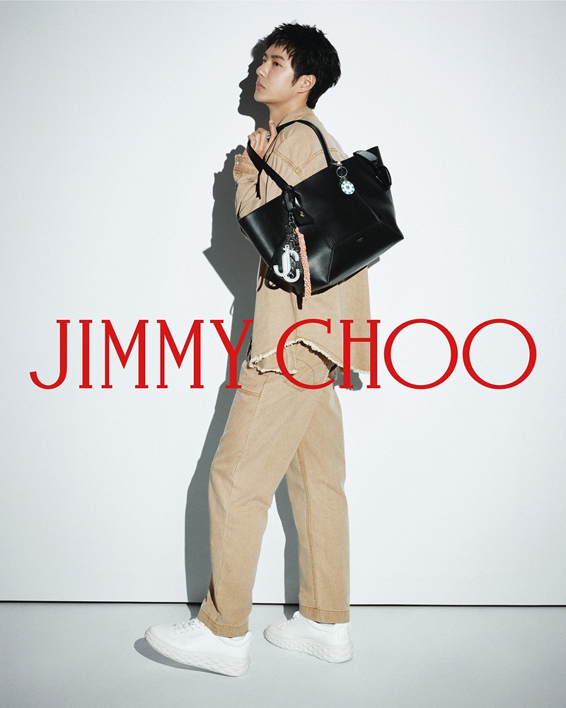 Wang Yibo wears Jimmy Choo’s Diamond Light Max trainers and carries the Diamond Tote.