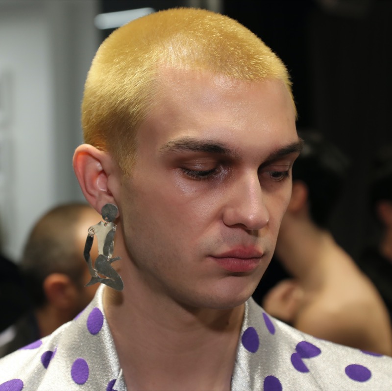 This vibrant yellow-toned buzz cut delivers a bold, high-fashion statement, perfect for those looking to stand out.