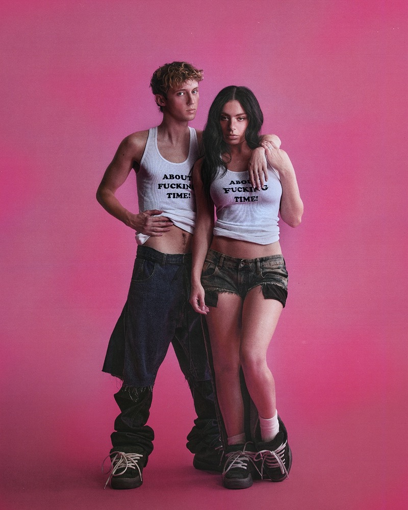 Troye Sivan wears a Stella McCartney tank, Jawara Alleyne jeans, and ERL shoes. Charlie XCX wears a Stella McCartney tank with Mengche Chiang shorts and ERL shoes.