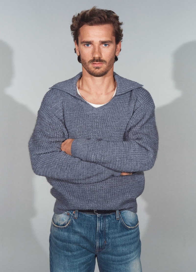 Antoine Griezmann wears a chunky sweater and jeans from Mango.