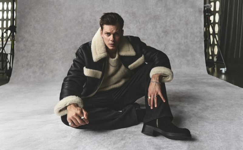 Bill Skarsgård wears a shearling jacket for the H&M Atelier fall 2024 campaign.