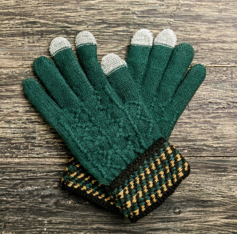 Stay warm and festive with green woolen gloves for the holidays.