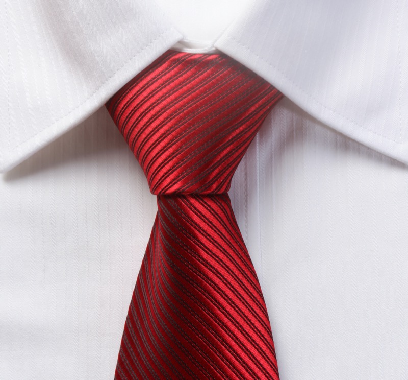 Wear colorful ties in festive hues such as red to update your holiday wardrobe.