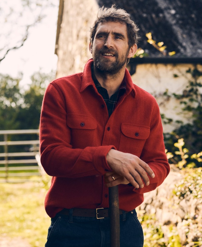 Showcasing rugged style, Will Chalker models a red brushed wool overshirt from J.Crew. 