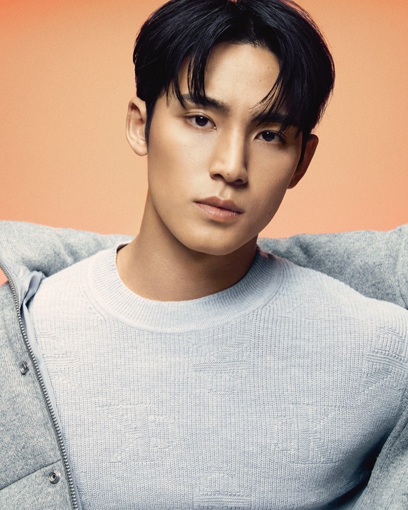 MINGYU wears a monogram CK sweater from Calvin Klein’s fall 2024 collection.