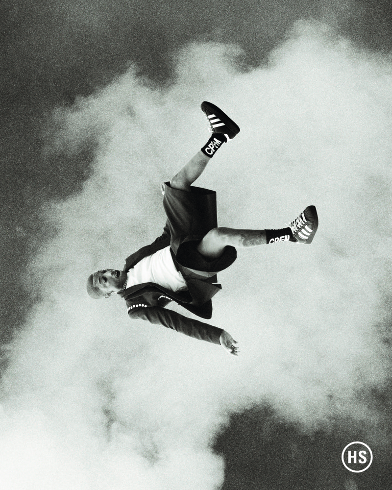 Captured in a black-and-white photo, Pharrell Williams appears in a Highsnobiety photo shoot. 