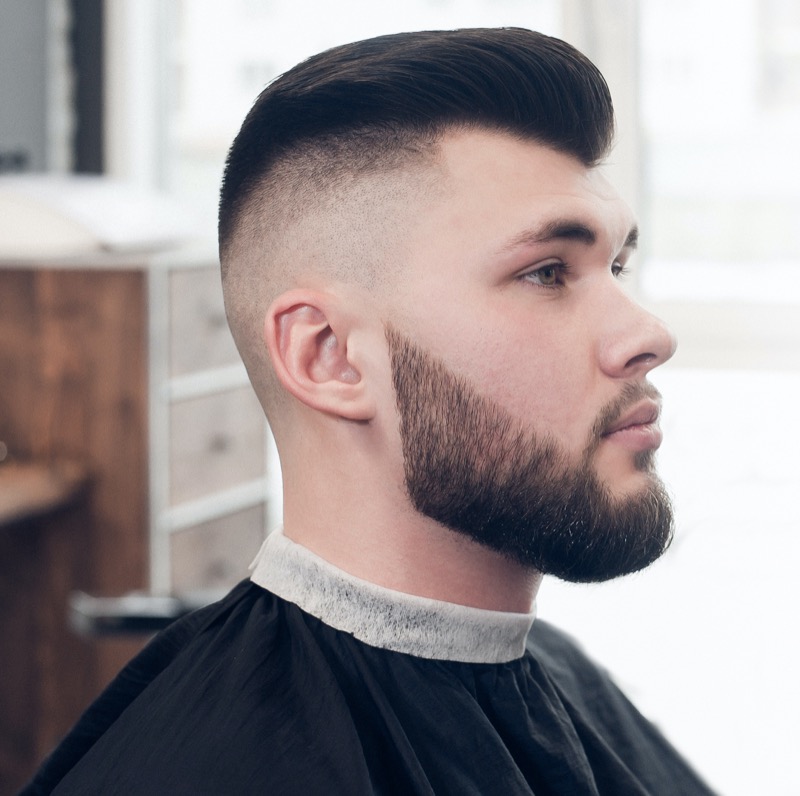 A pompadour paired with a razor fade blends vintage volume with modern sharpness. 