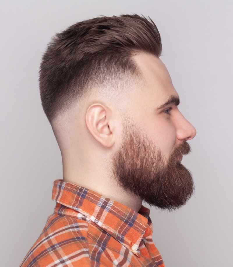 The razor fade modernizes a textured pompadour. 