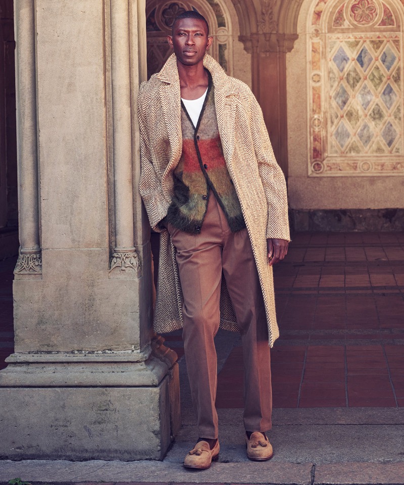 Armando Cabral wears Todd Snyder’s Italian wool topcoat in herringbone with a mohair-wool blend cardigan and Gurkha trousers.