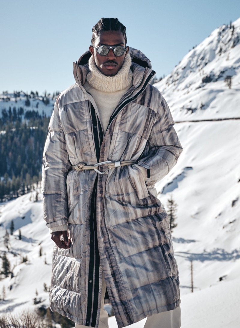 Anarcius Jean models a Todd Snyder for Woolrich Black Label abstract stripe long parka.